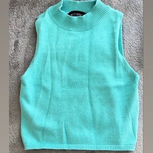 Kittenish turquoise top